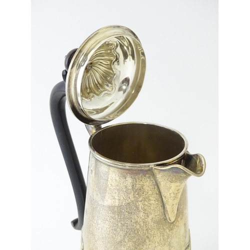 549 - A silver coffee pot with fluted decoration and ebonised handle hallmarked Birmingham 1907, maker Jos... 