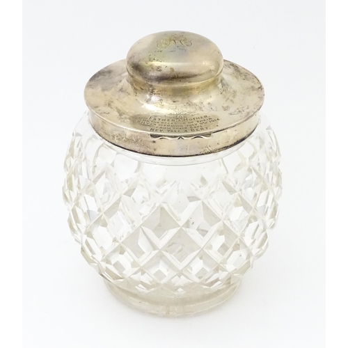 550 - A large cut glass jar with glass stopper and silver lid and mounts hallmarked Birmingham 1912, maker... 