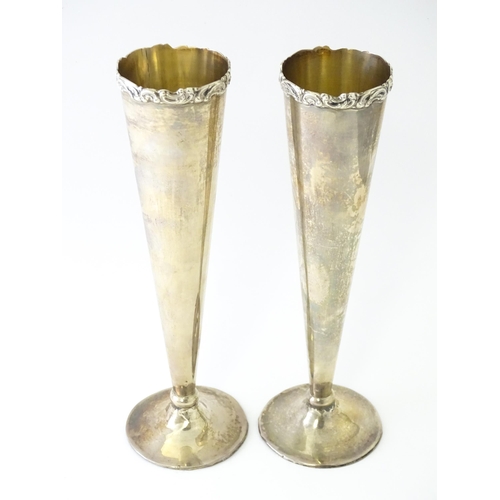 554 - A pair of silver vases of conical form hallmarked Birmingham 1923, maker Wilmot Manufacturing Co. Ap... 