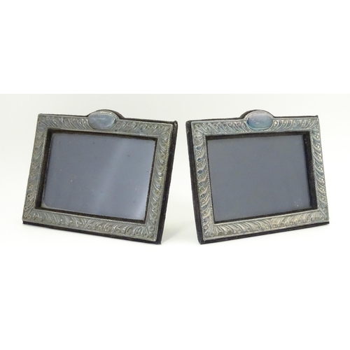 556 - A pair of easel back photograph frames with silver surrounds hallmarked London 1988, maker Keyford F... 