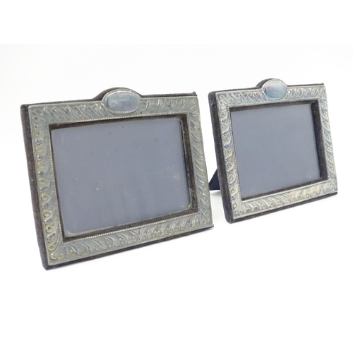 556 - A pair of easel back photograph frames with silver surrounds hallmarked London 1988, maker Keyford F... 