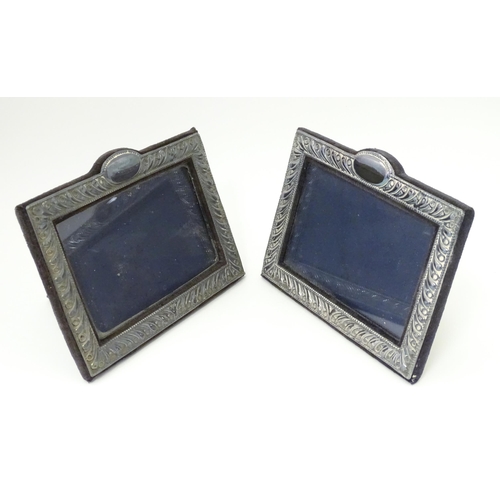 556 - A pair of easel back photograph frames with silver surrounds hallmarked London 1988, maker Keyford F... 