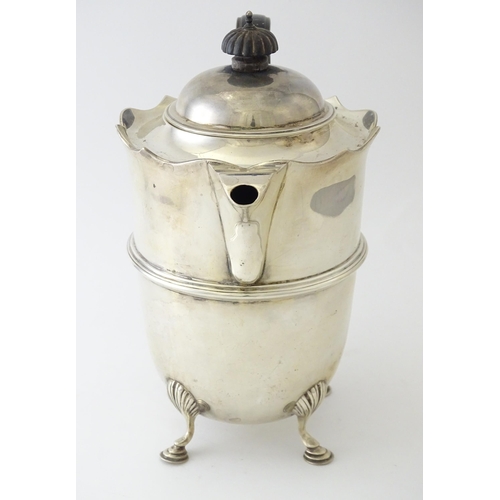 557 - A silver coffee pot with banded detail and ebonised handle, hallmarked London 1915, maker Mappin & W... 