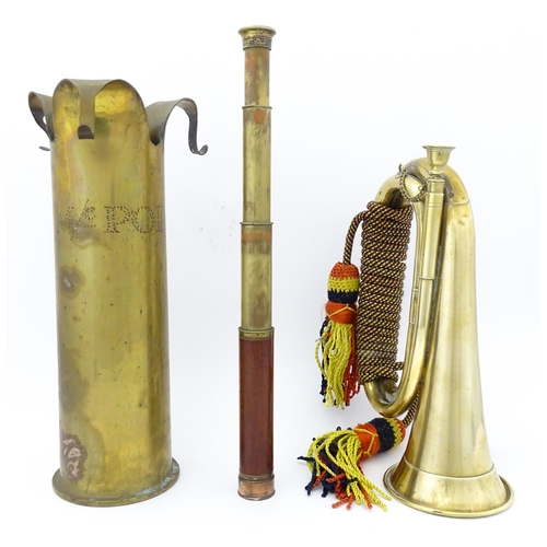 844 - Militaria : assorted items comprising a trench art 12pdr shell vase marked 'SS M/c. Port', a four-dr... 