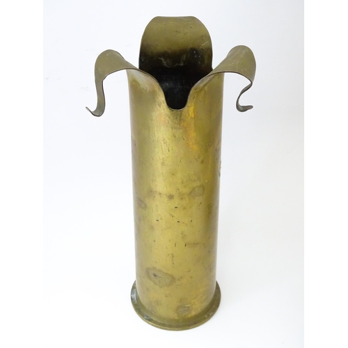 844 - Militaria : assorted items comprising a trench art 12pdr shell vase marked 'SS M/c. Port', a four-dr... 