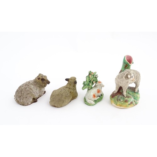 197 - Four ceramic models of sheep to include a 19thC Staffordshire hollow base lamb with bocage, a Staffo... 