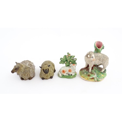 197 - Four ceramic models of sheep to include a 19thC Staffordshire hollow base lamb with bocage, a Staffo... 