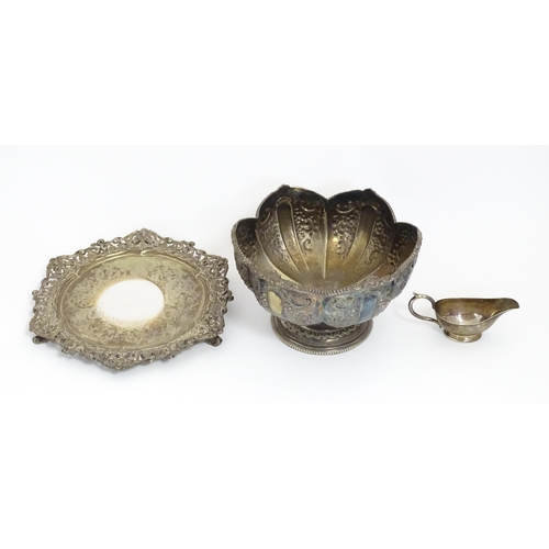 588 - Three items of silver plate comprising a salver, punch bowl and a sauce boat. Salver approx. 13