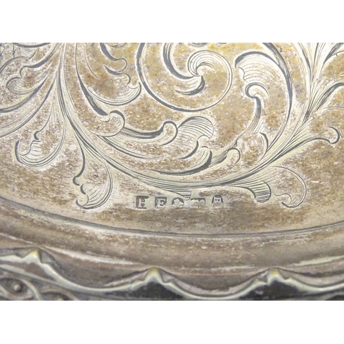 588 - Three items of silver plate comprising a salver, punch bowl and a sauce boat. Salver approx. 13