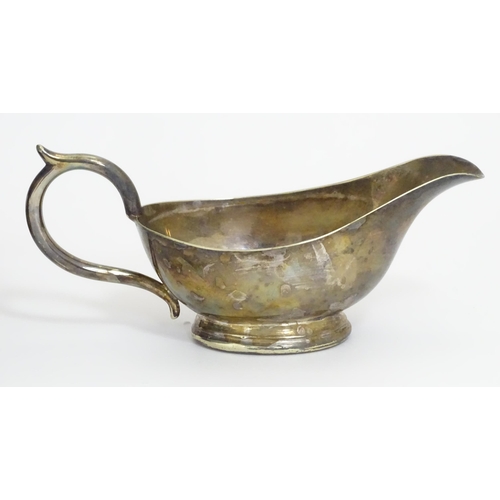 588 - Three items of silver plate comprising a salver, punch bowl and a sauce boat. Salver approx. 13