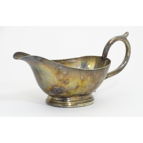 588 - Three items of silver plate comprising a salver, punch bowl and a sauce boat. Salver approx. 13