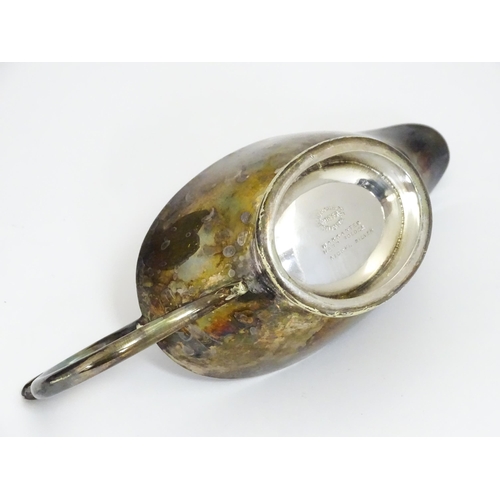 588 - Three items of silver plate comprising a salver, punch bowl and a sauce boat. Salver approx. 13