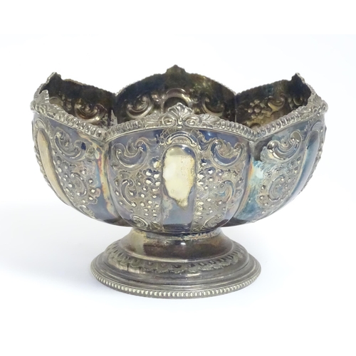 588 - Three items of silver plate comprising a salver, punch bowl and a sauce boat. Salver approx. 13