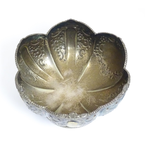 588 - Three items of silver plate comprising a salver, punch bowl and a sauce boat. Salver approx. 13