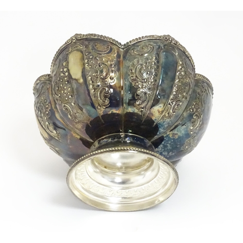 588 - Three items of silver plate comprising a salver, punch bowl and a sauce boat. Salver approx. 13