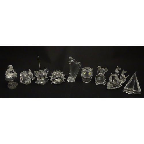 311 - A quantity of assorted Swarovski crystal ornaments to include rhino, swans, hedgehog, snail, elephan... 