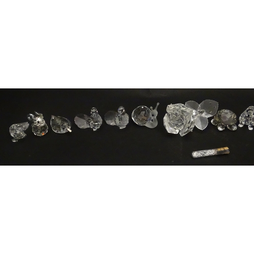 311 - A quantity of assorted Swarovski crystal ornaments to include rhino, swans, hedgehog, snail, elephan... 