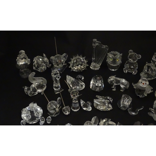 311 - A quantity of assorted Swarovski crystal ornaments to include rhino, swans, hedgehog, snail, elephan... 