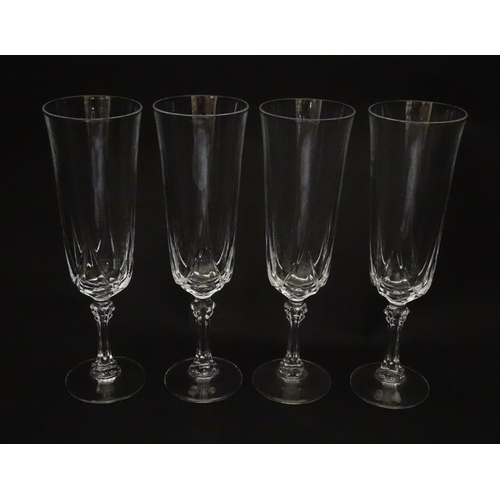 318 - A set of eight glass champagne flutes. Approx. 8