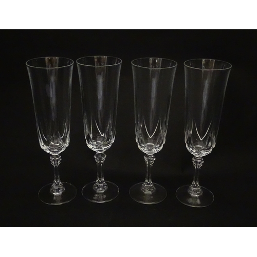 318 - A set of eight glass champagne flutes. Approx. 8