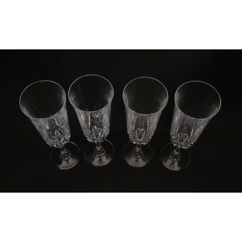 318 - A set of eight glass champagne flutes. Approx. 8