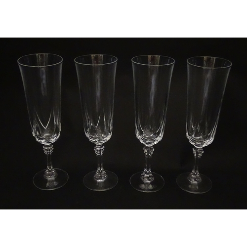 318 - A set of eight glass champagne flutes. Approx. 8
