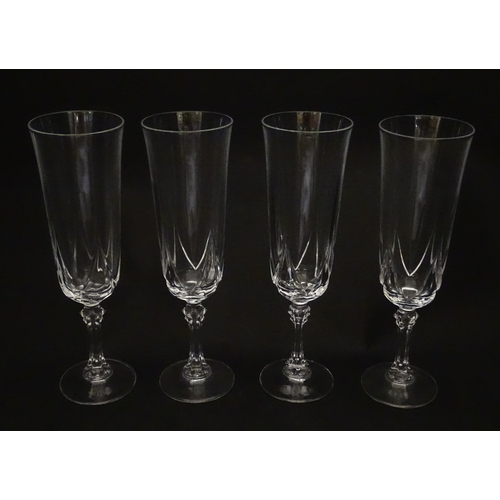 318 - A set of eight glass champagne flutes. Approx. 8