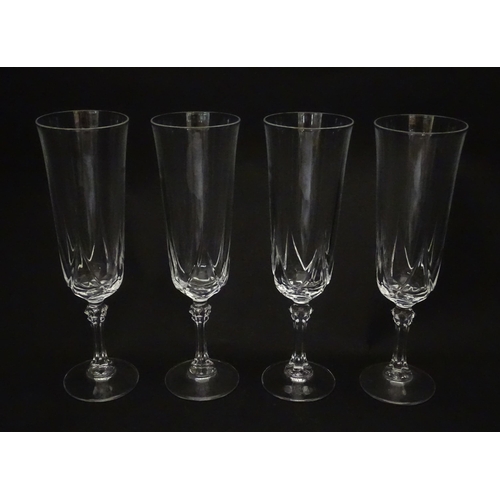 318 - A set of eight glass champagne flutes. Approx. 8