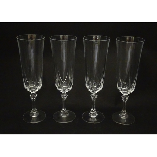318 - A set of eight glass champagne flutes. Approx. 8