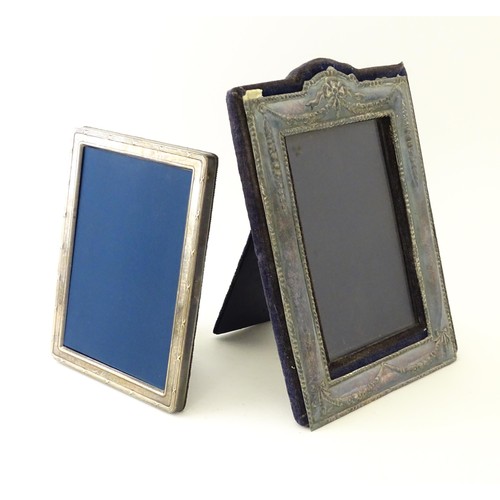 553 - Two easel back photograph frames with silver surrounds, one hallmarked Sheffield 1992, maker Carrs o... 