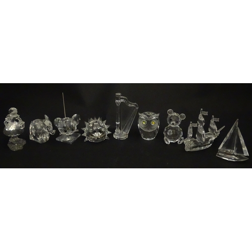 311 - A quantity of assorted Swarovski crystal ornaments to include rhino, swans, hedgehog, snail, elephan... 