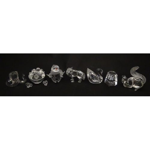 311 - A quantity of assorted Swarovski crystal ornaments to include rhino, swans, hedgehog, snail, elephan... 