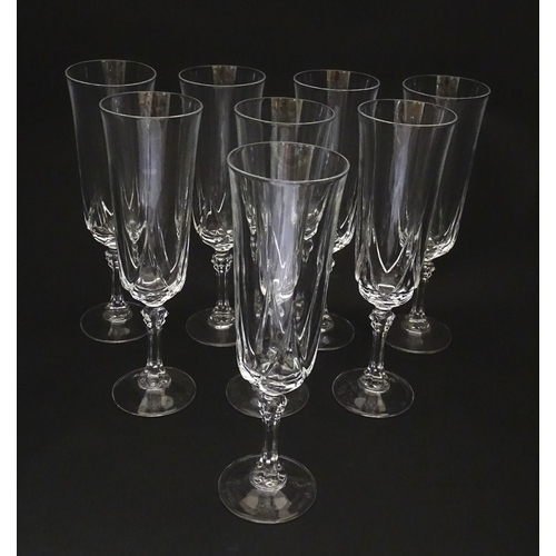 318 - A set of eight glass champagne flutes. Approx. 8