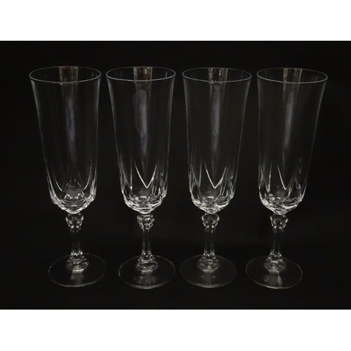 318 - A set of eight glass champagne flutes. Approx. 8