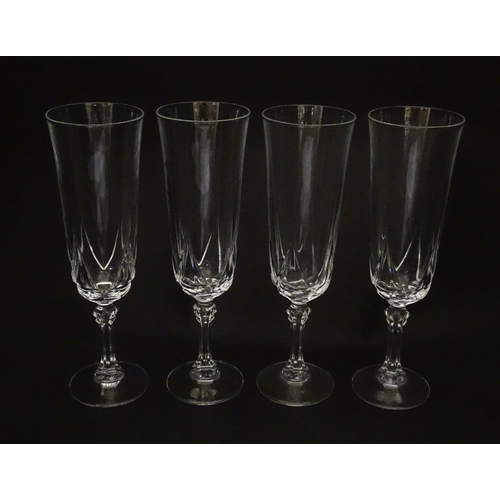 318 - A set of eight glass champagne flutes. Approx. 8