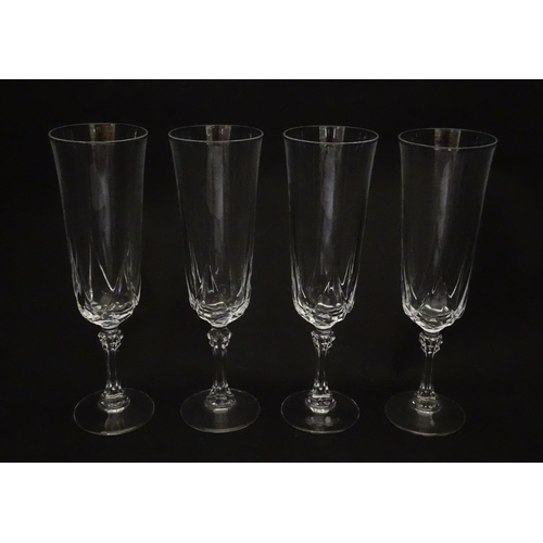 318 - A set of eight glass champagne flutes. Approx. 8