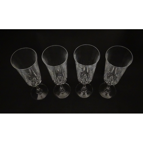 318 - A set of eight glass champagne flutes. Approx. 8