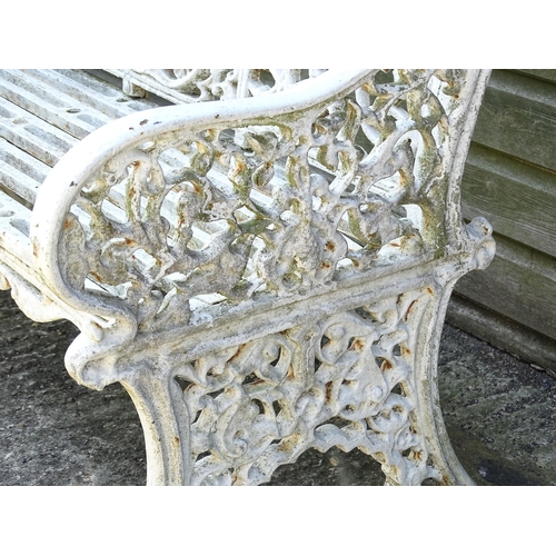 815 - Garden / Architectural : A late 19th / early 20thC cast iron garden bench with foliate decoration an... 