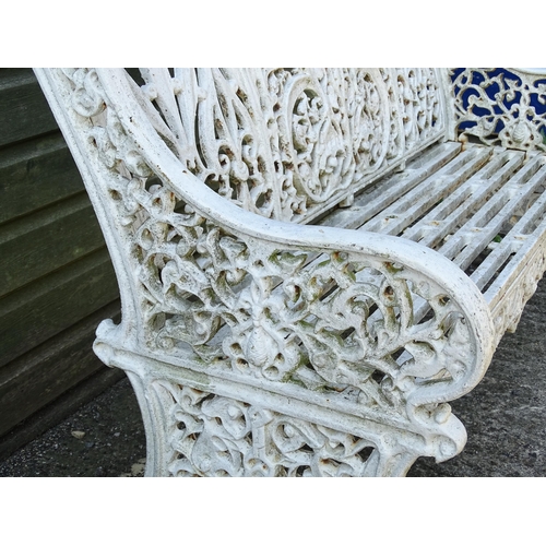 815 - Garden / Architectural : A late 19th / early 20thC cast iron garden bench with foliate decoration an... 