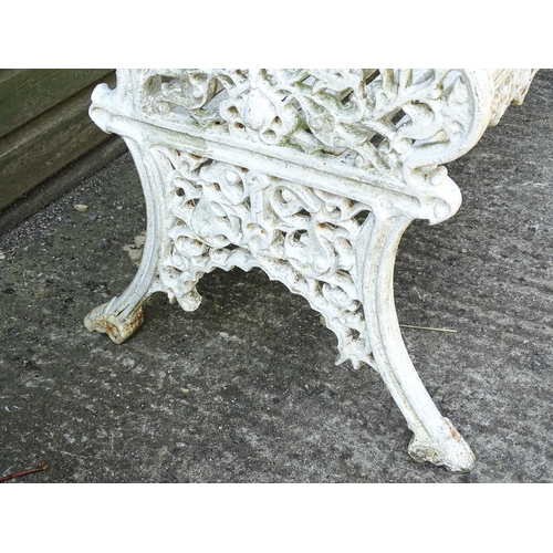 815 - Garden / Architectural : A late 19th / early 20thC cast iron garden bench with foliate decoration an... 