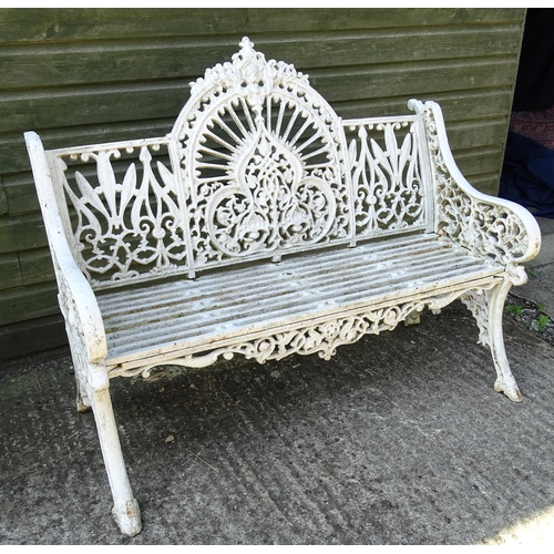 815 - Garden / Architectural : A late 19th / early 20thC cast iron garden bench with foliate decoration an... 