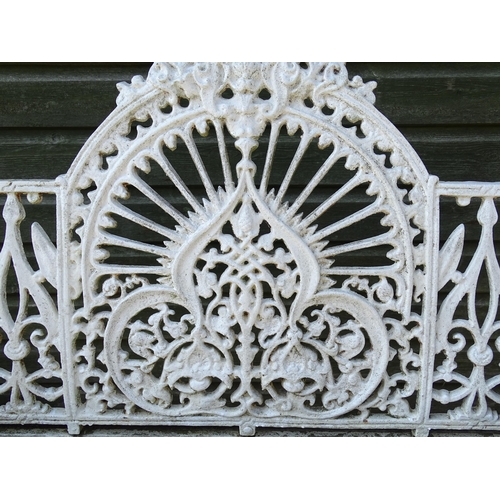 815 - Garden / Architectural : A late 19th / early 20thC cast iron garden bench with foliate decoration an... 