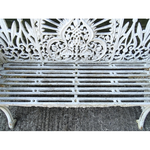 815 - Garden / Architectural : A late 19th / early 20thC cast iron garden bench with foliate decoration an... 