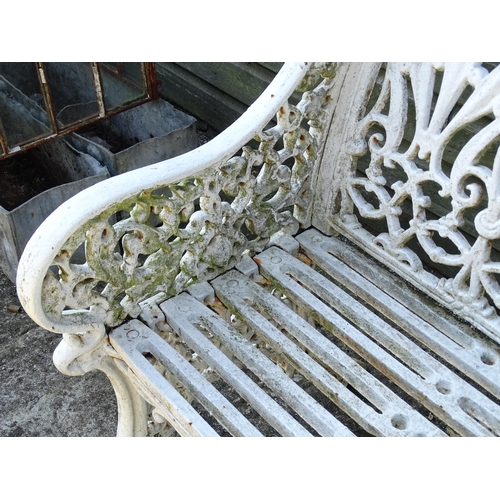 815 - Garden / Architectural : A late 19th / early 20thC cast iron garden bench with foliate decoration an... 