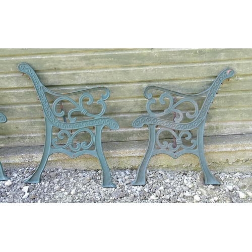 817 - Garden / Architectural : Four cast iron bench frame ends, with scroll decoration and green painted f... 