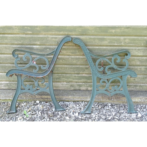 817 - Garden / Architectural : Four cast iron bench frame ends, with scroll decoration and green painted f... 