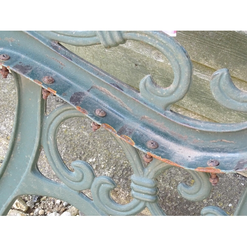 817 - Garden / Architectural : Four cast iron bench frame ends, with scroll decoration and green painted f... 