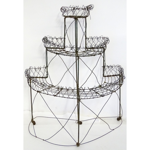 819 - Garden / Architectural : a Regency style wirework flower rack, of demi lune form in three tiers supp... 