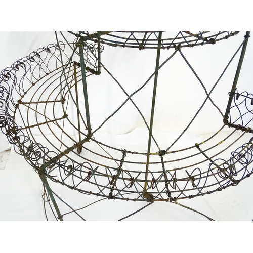 819 - Garden / Architectural : a Regency style wirework flower rack, of demi lune form in three tiers supp... 