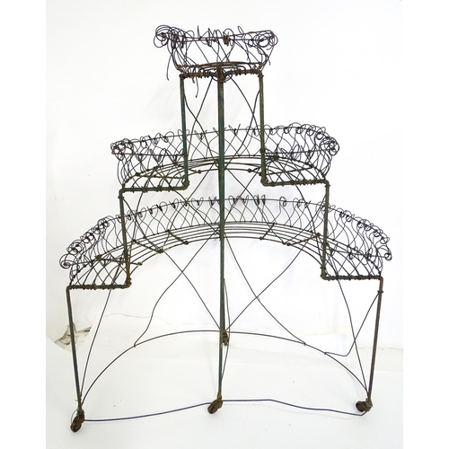 819 - Garden / Architectural : a Regency style wirework flower rack, of demi lune form in three tiers supp... 